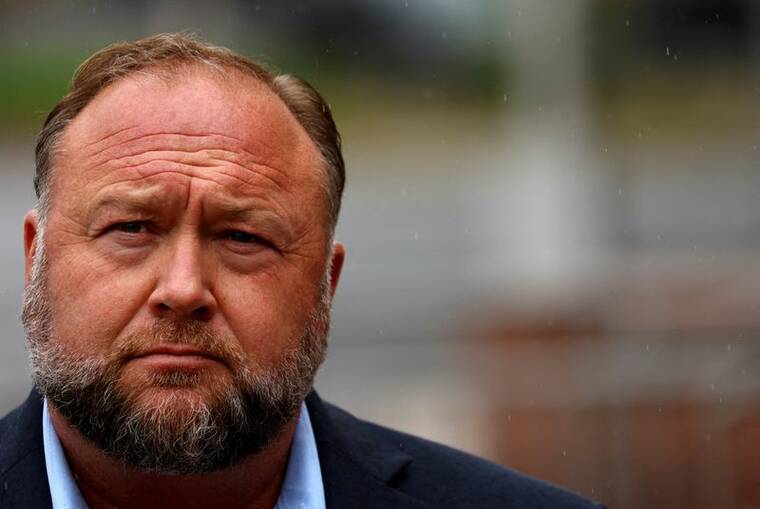 REUTERS/MIKE SEGAR/FILE PHOTO
Infowars founder Alex Jones arrives to speak to the media after appearing at his Sandy Hook defamation trial at Connecticut Superior Court in Waterbury, Conn., in October 2022.