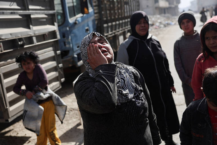 AMR ABDALLAH DALSH / REUTERS
An elderly woman reacts in Tadamon district, littered with bones after what residents and rights groups described as years of killings there under the rule of Syrias Bashar al-Assad, following al-Assads ousting by fighters of the ruling Syrian body, in Damascus this week.