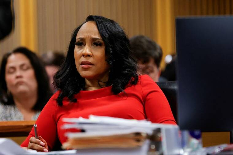 ALEX SLITZ/POOL VIA REUTERS/FILE PHOTO
Fulton County District Attorney Fani Willis attends a hearing on the Georgia election interference case, on March 1, in Atlanta, Ga. A Georgia appeals court ruled today that Fulton County District Attorney Fani Willis must be disqualified from prosecuting President-elect Donald Trump and several of his allies for attempting to interfere in the 2020 election in the U.S. state.
