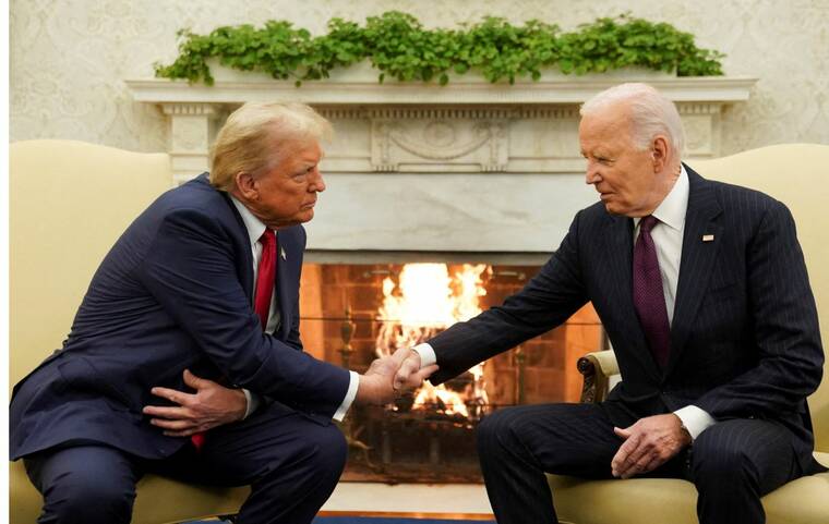 REUTERS/KEVIN LAMARQUE
President Joe Biden meets with President-elect Donald Trump in the Oval Office at the White House in Washington, today.