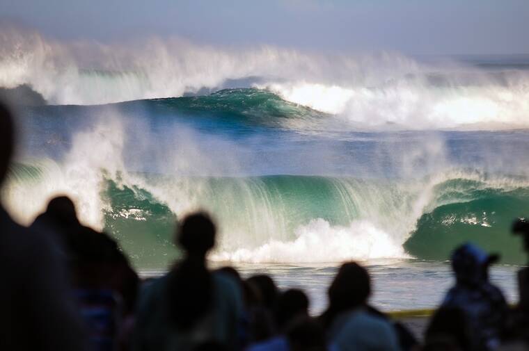 MICHELLE BIR / SPECIAL TO THE HONOLULU STAR ADVERTISER
Thousands gather to watch the Eddie Aikau Big Wave Invitational today at Waimea Bay.