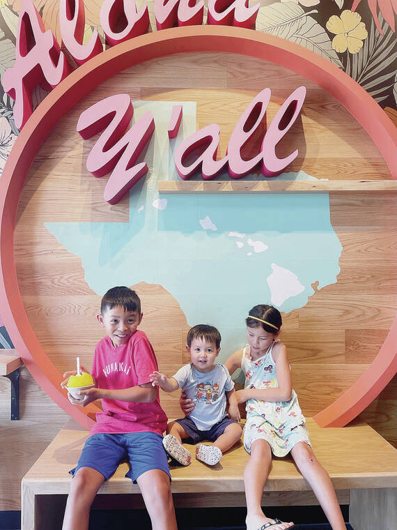 Faye Kurren of Honolulu shared a shot of her grandchildren enjoying a familiar cold treat at Ululani’s Hawaiian Shave Ice in Round Rock, Texas. Photo by Laura Ryckman.