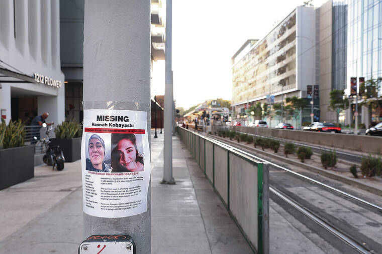 LOS ANGELES TIMES / NOV. 21
A flyer with photos of Hannah Kobayashi, who went missing Nov. 8, is posted near the Metro station where she was last seen in downtown Los Angeles.